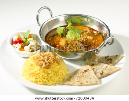 Indian curry served with rice and naan