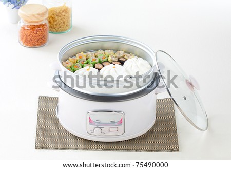 Electric rice cooker and the tray for steaming food
