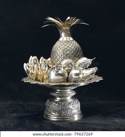 An antique carving silver in fruits shape in a silver tray