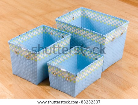 Three size of weaved plastic baskets