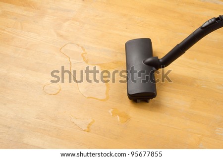 cleaning water on the floor with vacuum cleaner
