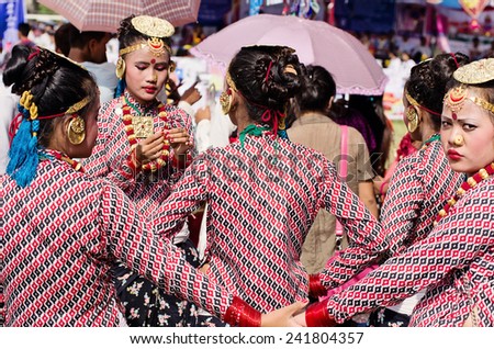 POKHARA, NEPAL - SEPTEMBER 15 - Unidentified Nepali girls prepare for a traditional dancing competition during Nepali festival called Dashain on September 15, 2013.
