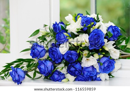 Brides bouquet of blue and white roses