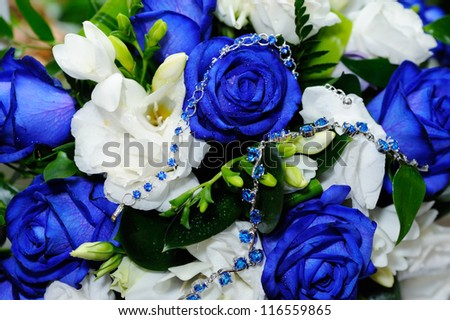 Brides blue rose bouquet and blue gem bracelets