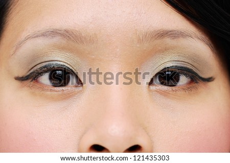 Asian girls eyes closeup with makeup
