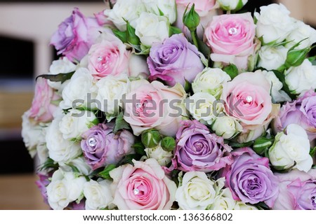 Brides flowers on wedding day with pink and purple roses
