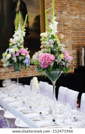 Floral Arrangement At Wedding Reception With Pink, Purple And White Flowers