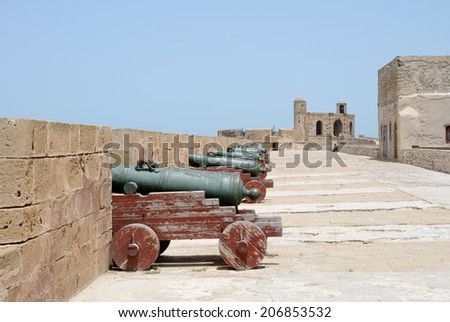 ESSAOUIRA, MOROCCO - MAY 14, 2014: Tourists exploring local historical landmark, a fortress close to the ocean. Essaouira, Morocco. May 14, 2014.