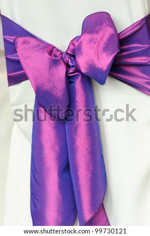Purple chair cover at wedding