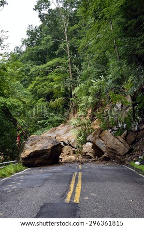 West Virginia Department of Highways workers seek to open highway closed by flashflood caused landslide along Birch River Road, Route 82 in Nicholas County, West Virginia, USA on July 13, 2015