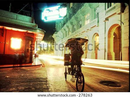 vendor on bicycle in old havana, cuba in front of Hemingway\'s haunt \