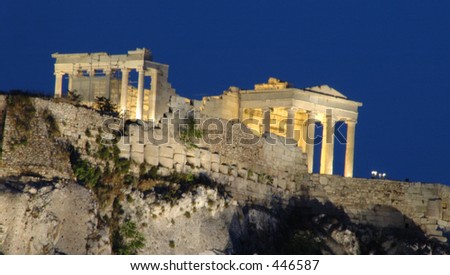 the parthenon acropolis at night in athens, greece with a blue post sunset sky