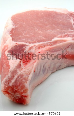pork chop with focus on cut bone fading to the background