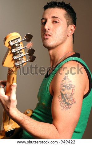 bass player with tattoo and attitude