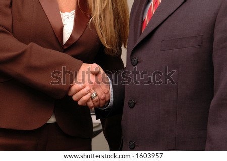 man and woman business hand shake