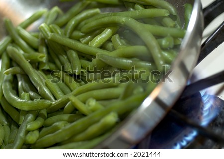 green beans in pan on the stove cooking with steam horizontal