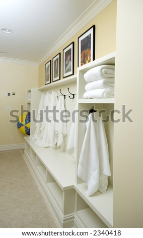 bathrobes towels hanging in a custom locker room