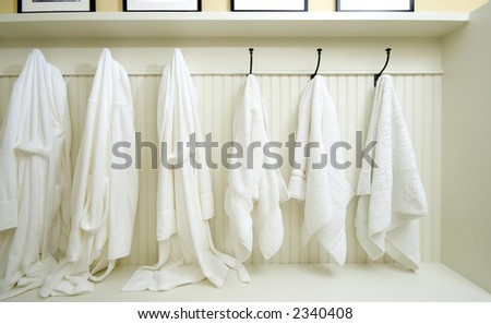 bathrobes towels hanging in a custom locker room