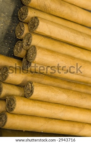 stack of hand made custom cigars luxury expensive