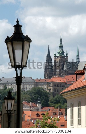 typical street scene in prague with presidential palace in background