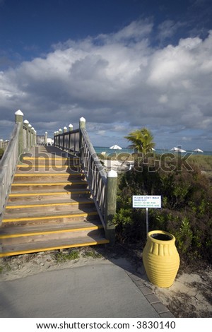 don\'t walk barefoot sign caribbean beach boardwalk