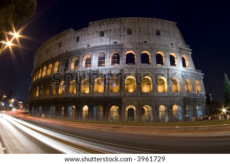 stock photo colosseum rome italy night time with car light streaks 