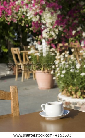 coffee in restaurant taverna with garden flowers greek islands