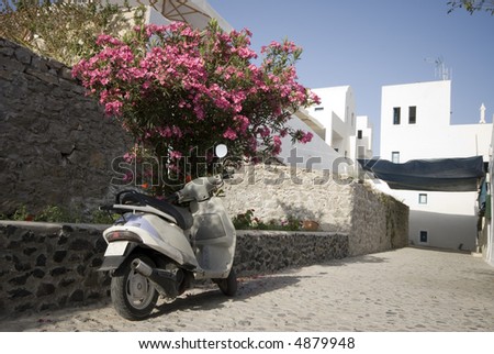 street scene greek islands motor bike scooter with stone road
