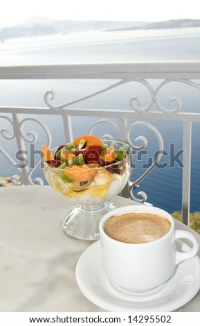 cafe with view of caldera santorini island greece coffee and yogurt with fruit and honey classic breakfast