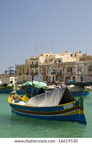 Malta Marsaxlokk native fishing boat luzzus, luzzu wooden archtitecture fishing village Mediterranean sea