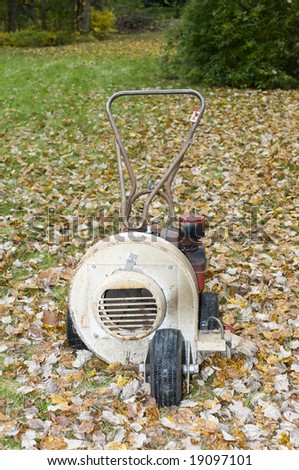 old rusty leaf blower for lawn maintenance in the autumn