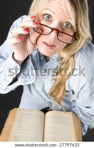 pretty attractive blond woman reading book eyeglasses
