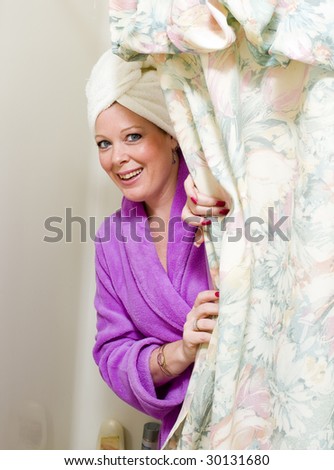 pretty woman coming out of shower bath with towel and bathrobe