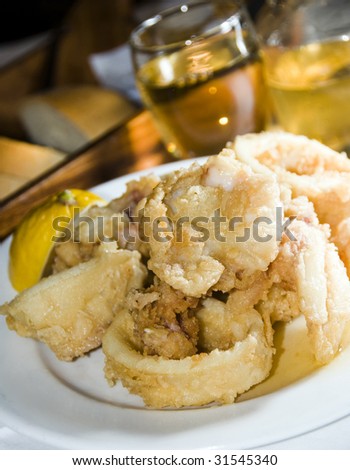 fried calamari squid greek food taverna specialty with home made wine as photographed in the greek islands santorini