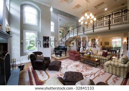 living room with fireplace and french doors in luxury estate mansion home