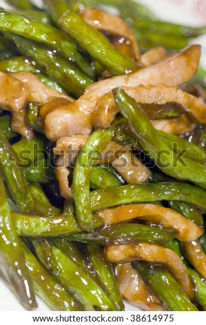 chinese food grilled chicken filet strips with string beans in spicy garlic brown sauce