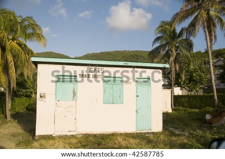 typical colorful caribbean style take away restaurant architecture in bequia st. vincent and the grenadines islands