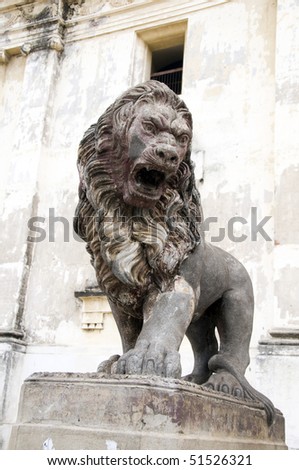 protective lion statue sculpture in front of the cathedral of leon nicaragua central america