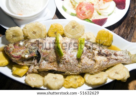 complete dinner central american typical king fish yellow tail   fish dinner fried plantains tostones rice and local fresh food salad as photographed in corn island nicaragua central america