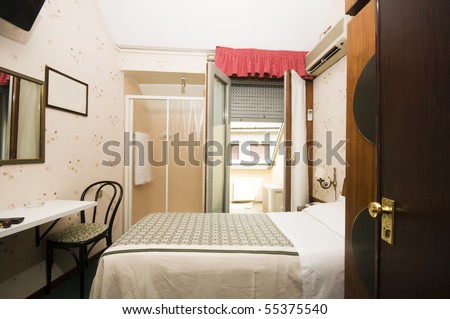 interior small single two star hotel room with shower in room Milan Italy Europe