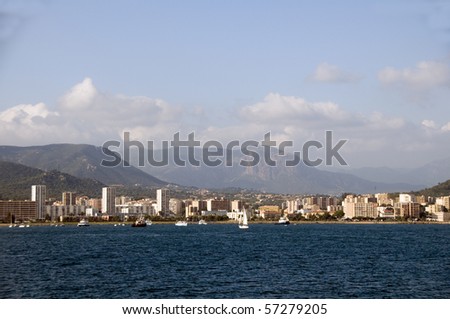 panorama of waterfront with hotels retail stores landscape with mountains ajaccio corsica france mediterranean sea