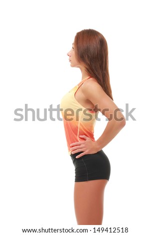 Attractive slim female fitness model. Caucasian, brown hair, brown eyes, 20 - 30 years old, young. Profile
