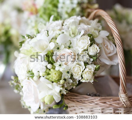 Beautiful white wedding bouquets in basket