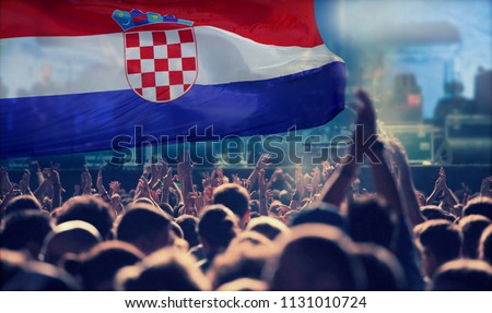 Silhouette of Croatia supporter fans cheering on soccer game