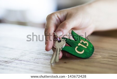 Guest leaving hotel room key on reception
