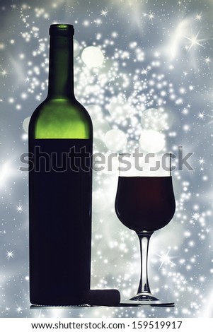 Red wine against holiday lights