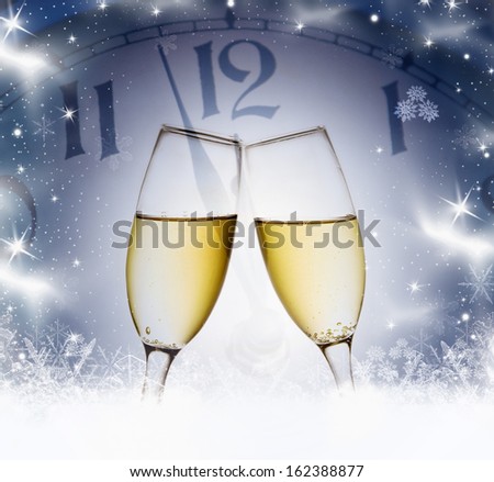 Wine glasses and clock at midnight