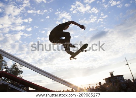 BONTIDA - JUNE 21: Unidentified skateboarder doing a slide trick during the Skateboard Competition at Electric Castle Festival on June 21, 2014 in the Banffy castle in Bontida, Romania