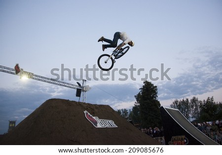 BONTIDA - JUNE 21: Unidentified BMX rider making a bike jump during the BMX Competition, at Electric Castle Festival on June 21, 2014 in the Banffy castle in Bontida, Romania