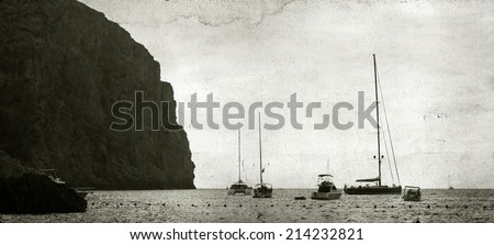 Vintage, black and white photo of sailing boats over the mediterranean sea
